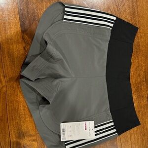 Athleta Ascender shorts in size 4. Dark grey/olive color. NWT